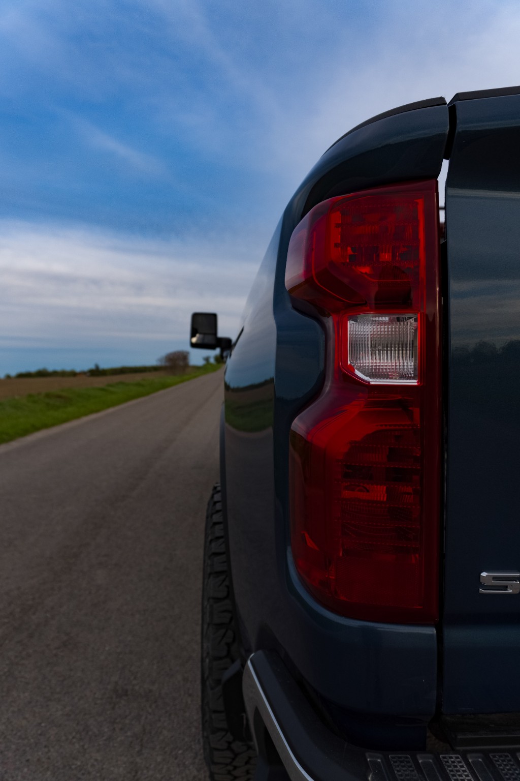 Truck taillight detail photo on road